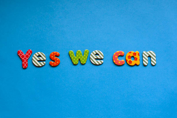 colored text  yes we can on blue paper background