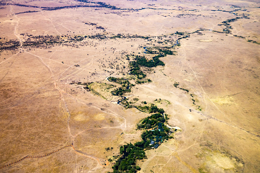 Aerial view of arid brown dramatic landscape at National Park in Kenya,East Africa during sunny day