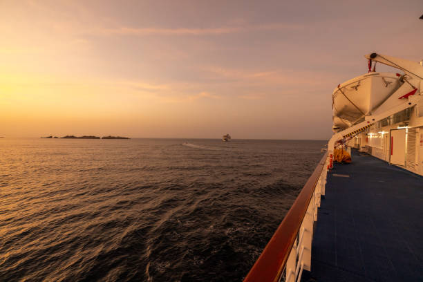 istock Cruise ship on idyllic rippled seascape with beautiful horizon against dramatic sky during sunset 1466771963