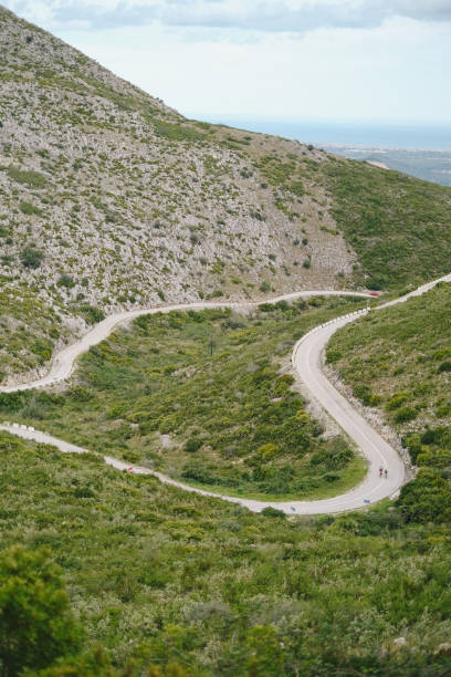 istock Road winds through steep cliffs and lush valley 1466774306
