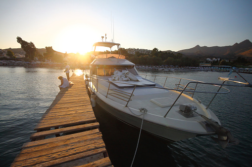 Bodrum,Turkey. 26 August 2015: Boats are waiting to sail on the Karaincir beach of Bodrum, the popular holiday destination.