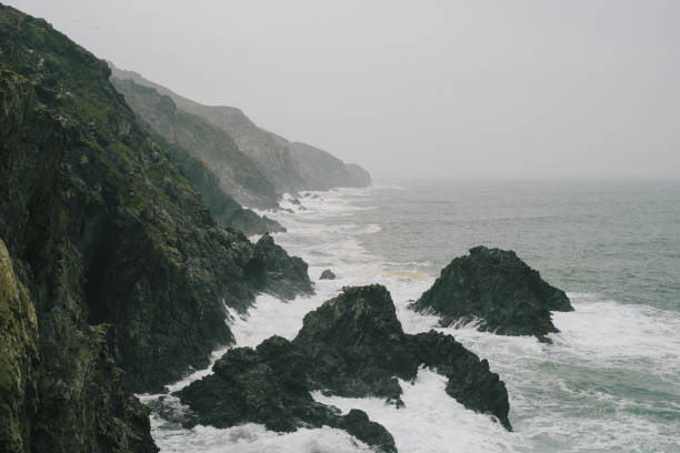 Waves crash on coastline