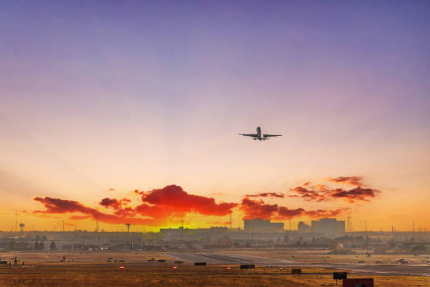 Airplane taking off from runway in Pearson International airport at dusk, Toronto,Canada stock photo