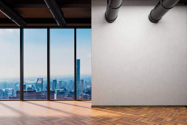 istock large office with blank white wall and copy space in front of panoramic window skyline view, wooden parquet floor; 3D Illustration 1466778217
