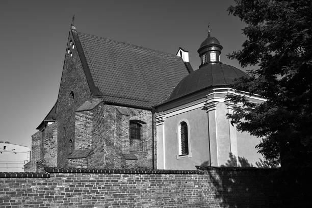 istock medieval, historic church behind a brick wall 1466780178