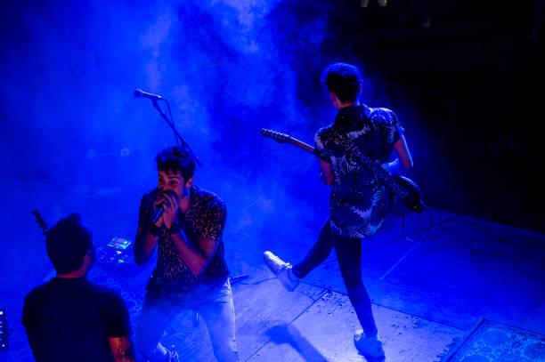 istock Rock and roll group performing live at night 1466780592