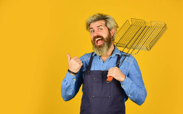 istock Ultimate cooking challenge. prepare dinner for family. use cooking utensils and various products. mature chef use cooking utensils for barbecue. Tools for roasting meat. Who cook better. copy space 1466782673