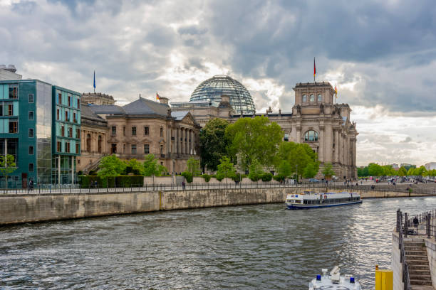 istock Reichstag building and Spree river at sunset, Berlin, Germany 1466783290