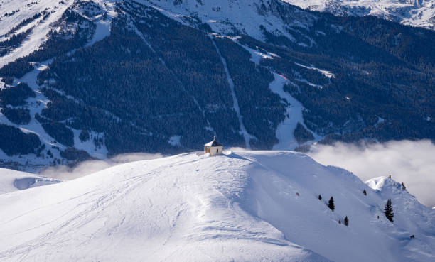 Bozelet chapel built at Mont de la Guerre in French Savoy Alps, altitude 2276 m. Bozelet chapel built at Mont de la Guerre in French Savoy Alps, altitude 2276 m. Small chapel on snowcapped mountain leisure activity french culture sport high angle view stock pictures, royalty-free photos & images