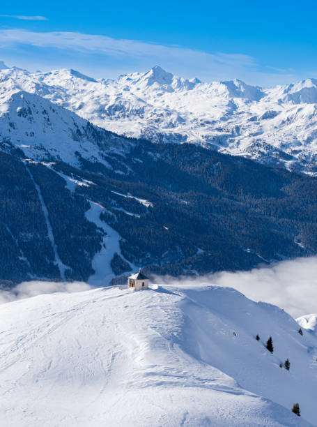 Bozelet chapel built at Mont de la Guerre in French Savoy Alps, altitude 2276 m. Bozelet chapel built at Mont de la Guerre in French Savoy Alps, altitude 2276 m. Small chapel on snowcapped mountain leisure activity french culture sport high angle view stock pictures, royalty-free photos & images