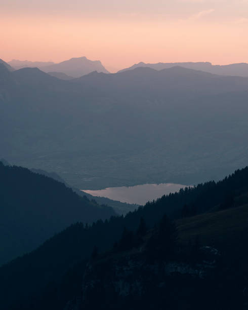 istock Sunrise illuminates snowcapped mountains 1466787581
