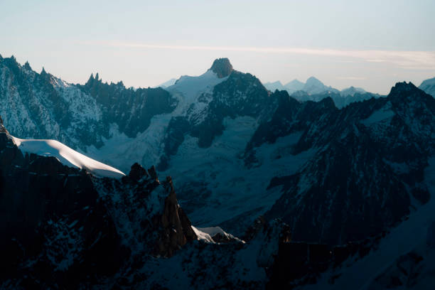 Clouds swirl around the Aiguille du Midi in the French Alps at le Mont Blanc