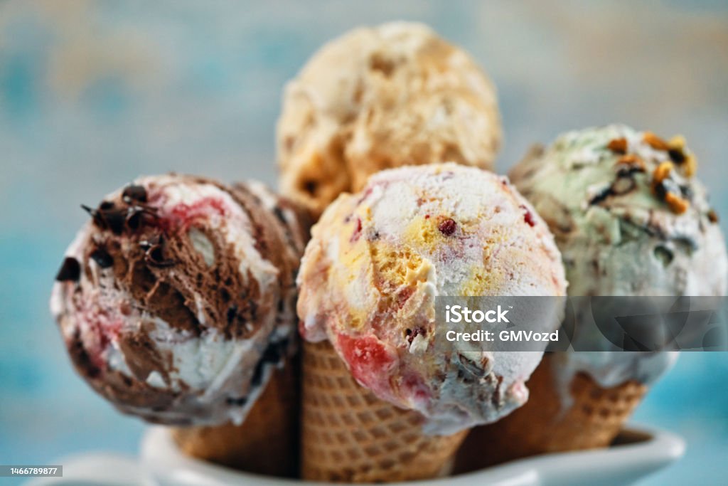 Pistachio, Chocolate, Strawberry and Vanilla Ice Cream in a Cone Ice Cream Stock Photo