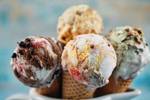 Pistachio, Chocolate, Strawberry and Vanilla Ice Cream in a Cone stock photo