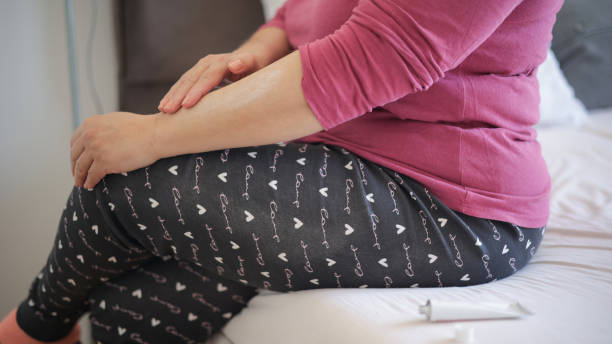 istock Woman applying gel to her arm 1466796664