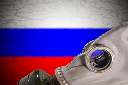 Gas mask on the background of the flag of Russia, the concept of nuclear weapons