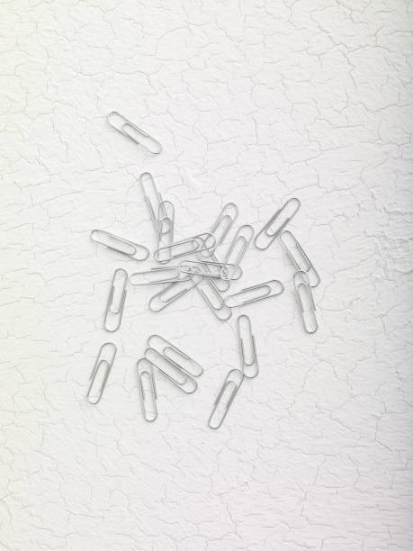 Paperclips on the Cracked white background