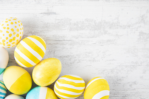 Easter eggs on white rustic background
