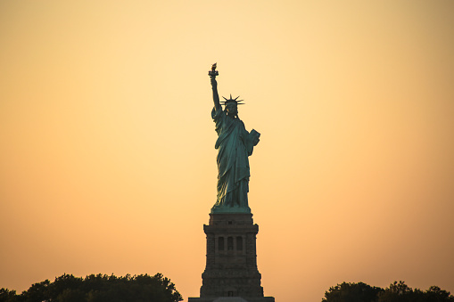 A view of the Statue of Liberty at dawn.