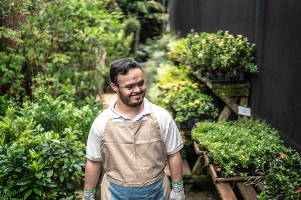 istock Young special needs botanist analyzing plants in a garden center 1466802807