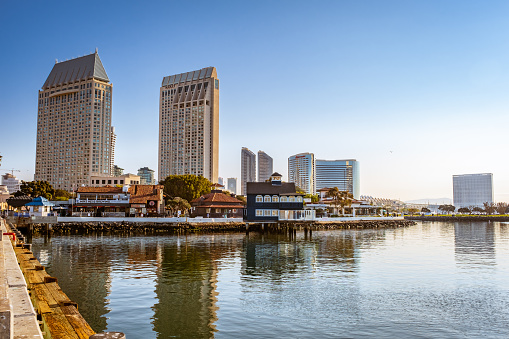 San Diego, CA - December 18, 2022: View of waterfront area known as Seaport from a dock. Shows the Manchester Grand Hyatt, the Marriott and Hilton in the distance.