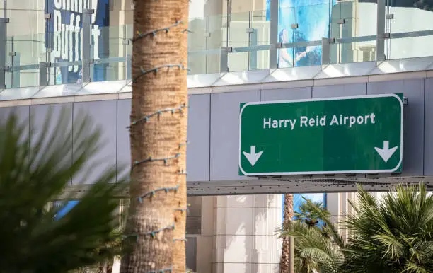 A sign leads drivers towards Harry Reid Airport in Las Vegas, Nevada, USA.