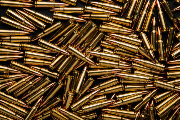 istock Background from cartridges for a carbine. Ammunition for modern weapons. 1466809833