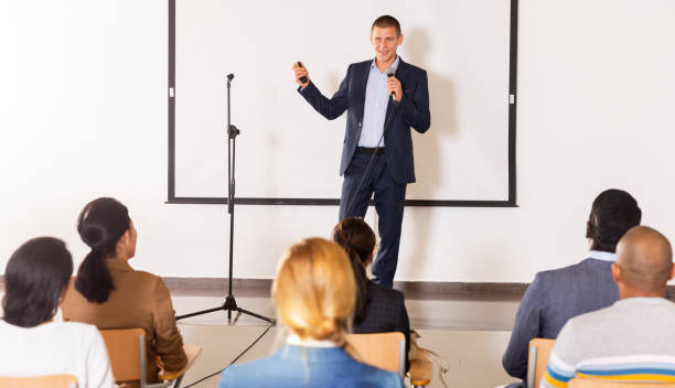 istock Male coach giving speech at conference hall 1466816419