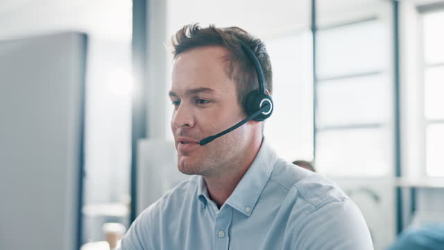 Call center, businessman and crm consulting in office for telemarketing, help or customer service. Customer support, consultant and man on virtual call for contact us, support and friendly assistance