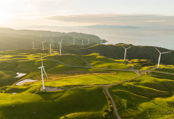 istock Wind turbine mills on coastal hills. 1466828521
