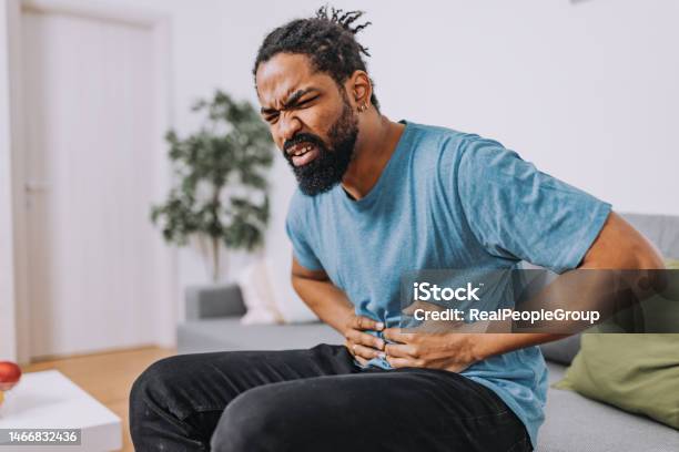 Man With A Stomachache Stock Photo - Download Image Now - Irritable Bowel Syndrome, Stomachache, Intestine