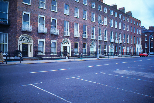 1980s old Positive Film scanned, the street view close to Merrion Square Park, Dublin, Ireland.