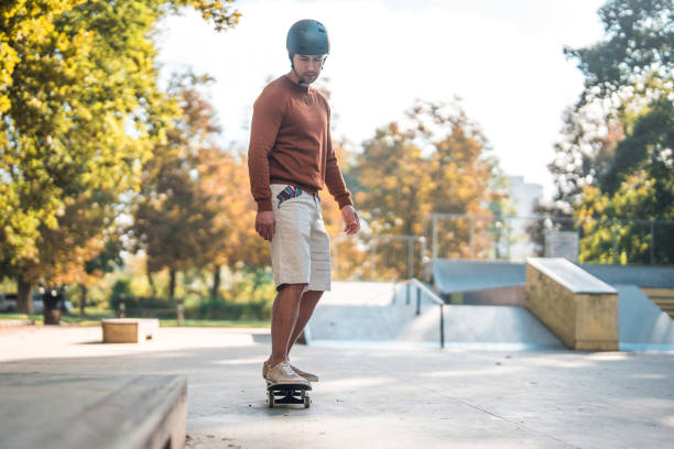 istock Biracial Sporty Man  Skateboarding Down the Slope 1466838514