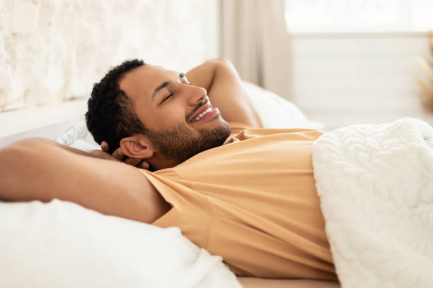 istock Arabic Man Relaxing Lying With Eyes Closed In Modern Bedroom 1466839607