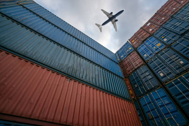 istock Freight airplane flying above overseas shipping container . Logistics supply chain management and international goods export concept . 1466846913