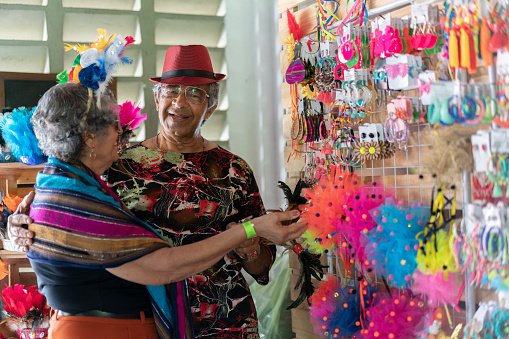 Elderly couple buying crafts at the craft fair