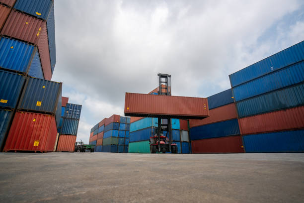 istock Cargo container for overseas shipping in shipyard with heavy machine . Logistics supply chain management and international goods export concept . 1466847036