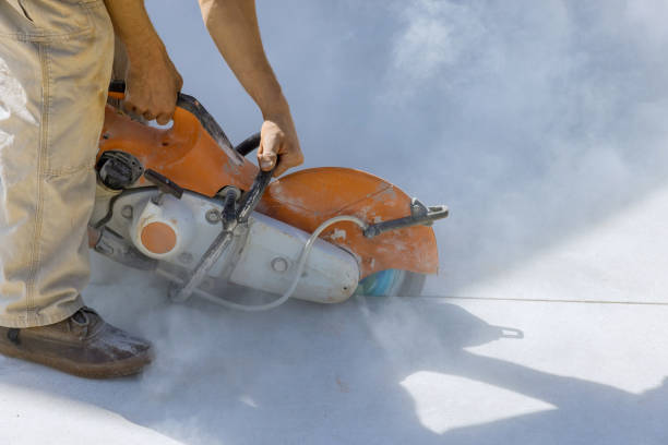 istock Diamond blade saw used by construction worker to cut concrete sidewalk 1466849576