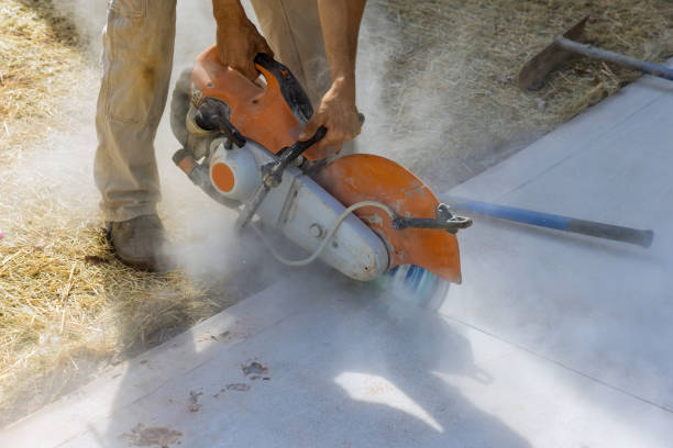 istock A construction worker uses a diamond blade saw to cut concrete sidewalks 1466849577