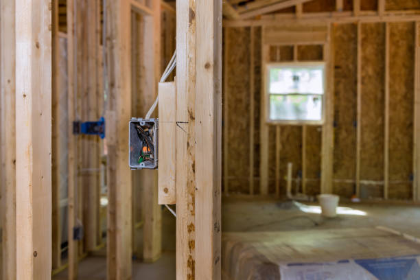 istock An unfinished wood frame house with basic electrical wiring is being constructed on a new residential construction site 1466849694