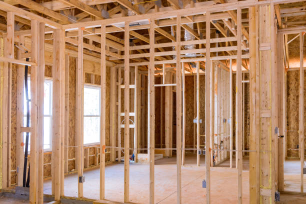 istock A wood frame unfinished for residential construction is framed by framing beams 1466849700