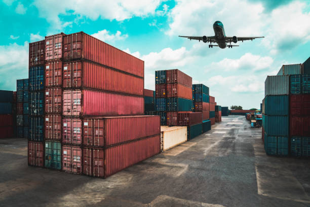 istock Cargo container for overseas shipping in shipyard with airplane in the sky . Logistics supply chain management and international goods export concept . 1466851665