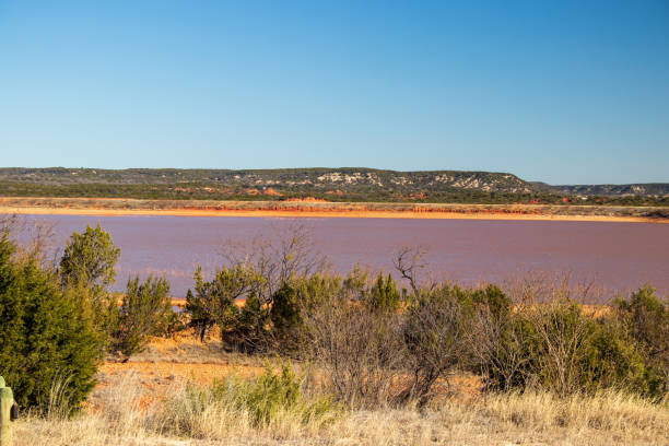 Reservoir Lake Abilene Texas Beautiful Hill Country Abilene Lake with red sandy shorelines and rolling hills in the background the Reservoir provides water to the city of Abilene. abilene texas stock pictures, royalty-free photos & images