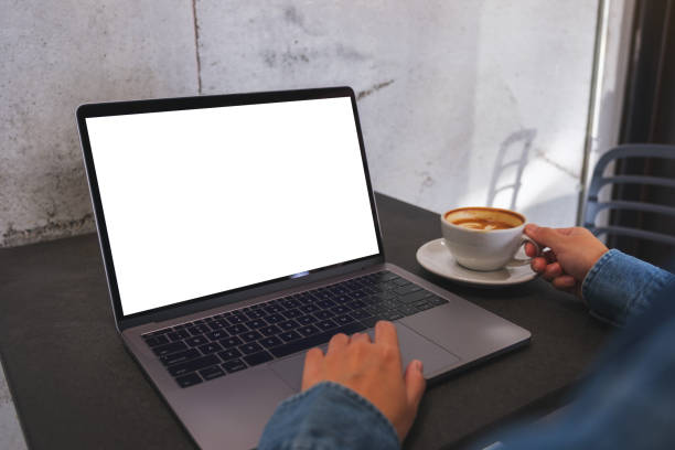 istock Mockup image of a woman using and working on laptop computer with blank white desktop screen 1466862757