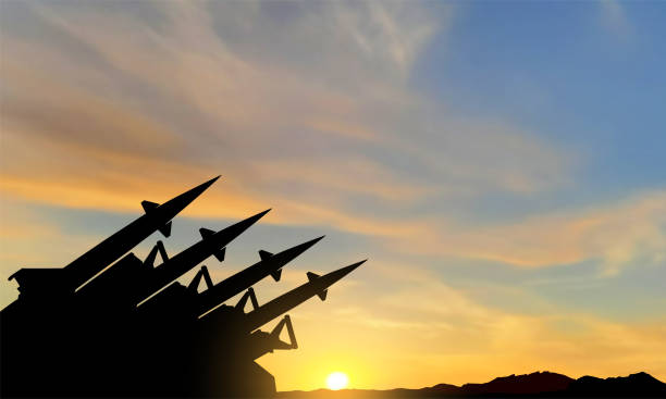 The missiles are aimed at the sky at sunset. Nuclear bomb, chemical weapons, missile defense, a system of salvo fire. The missiles are aimed at the sky. Nuclear bomb, missile defense, a system of salvo fire. EPS10 vector gun violence stock illustrations