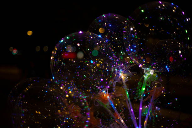 istock Colored balls in dark. LED Plastic Bulbs. Beautiful glow on black background. 1466895131