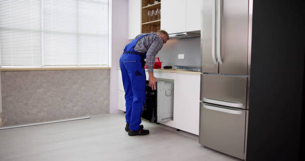 istock Oven Repair Technician. Appliance Maintenance Service 1466896245