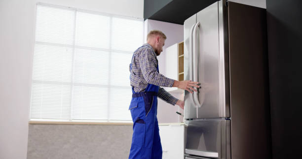 istock Male Worker Repairing Refrigerator With Screwdriver 1466896421