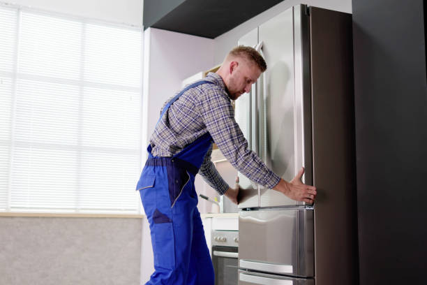 istock Male Worker Repairing Refrigerator With Screwdriver 1466896433