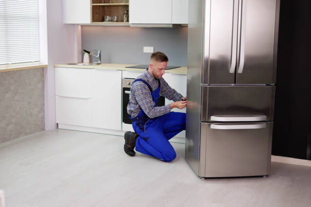 istock Male Worker Repairing Refrigerator With Screwdriver 1466896482